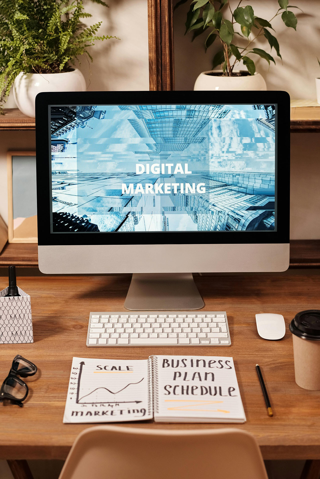 Laptop on a desk with the words "Digital Marketing" on the screen