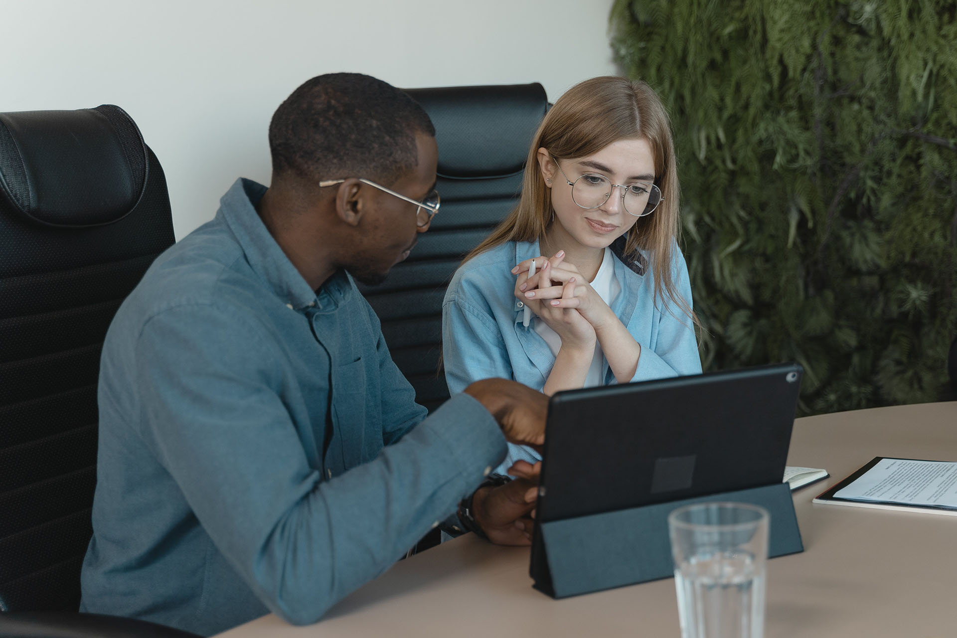 Man and woman looking at a computer screen