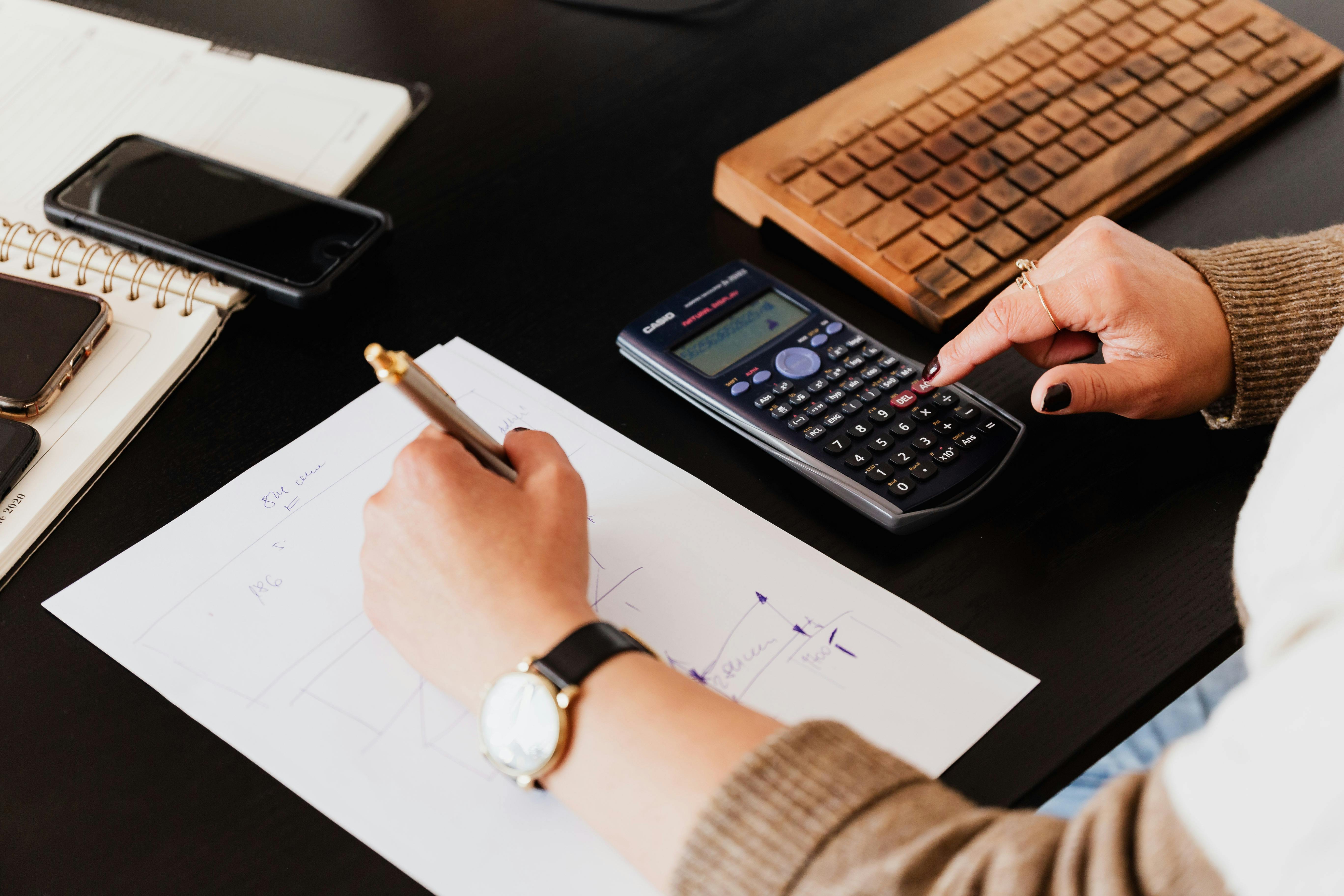 Woman using a  calculator