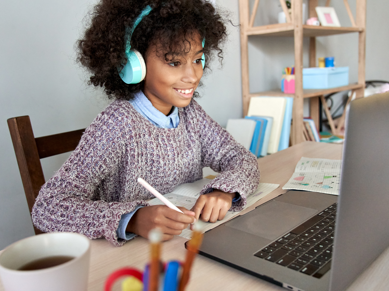 child engaging with online learning