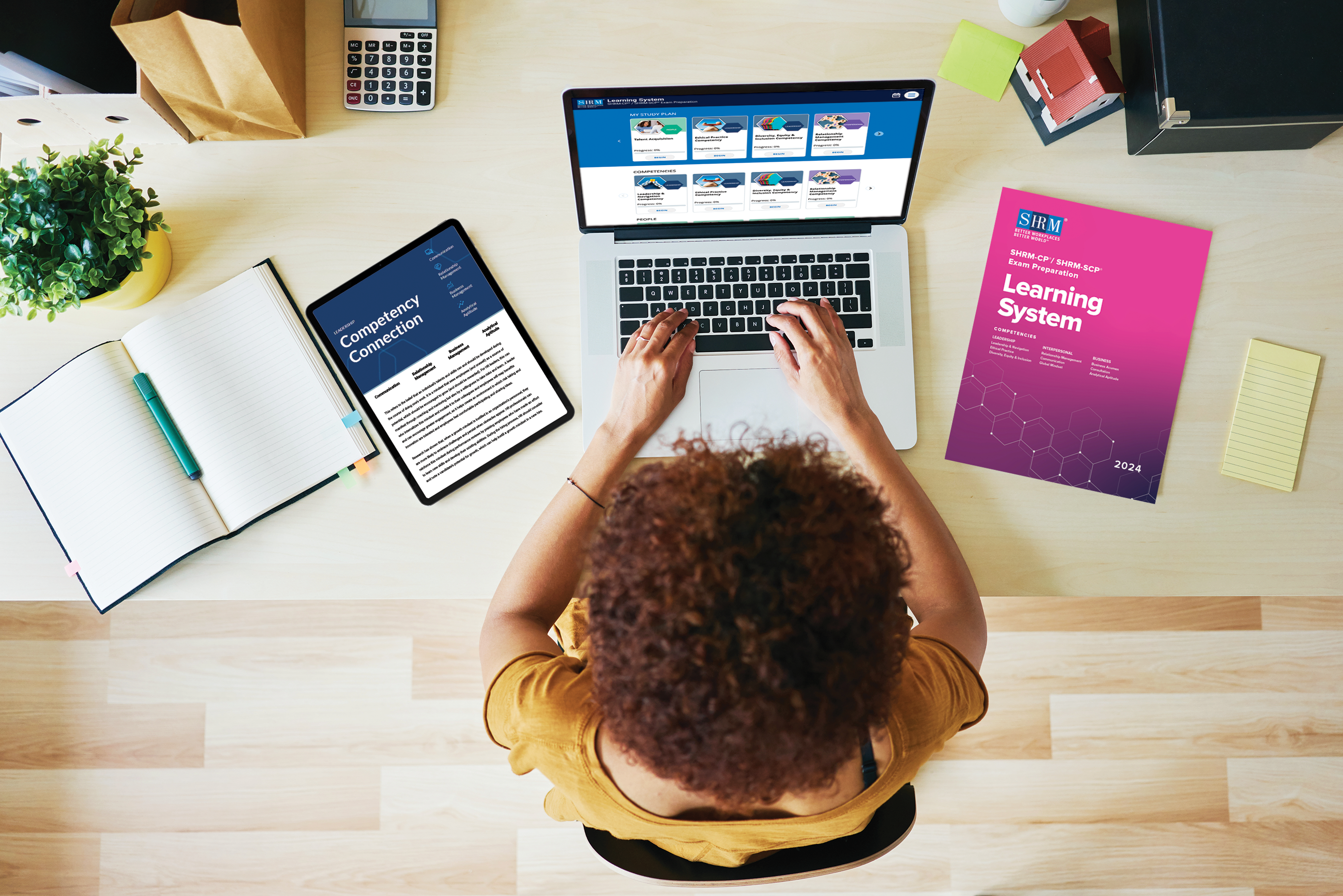 SHRM Student sitting at a desk studying