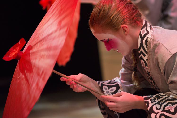 Actor performing in makeup on stage