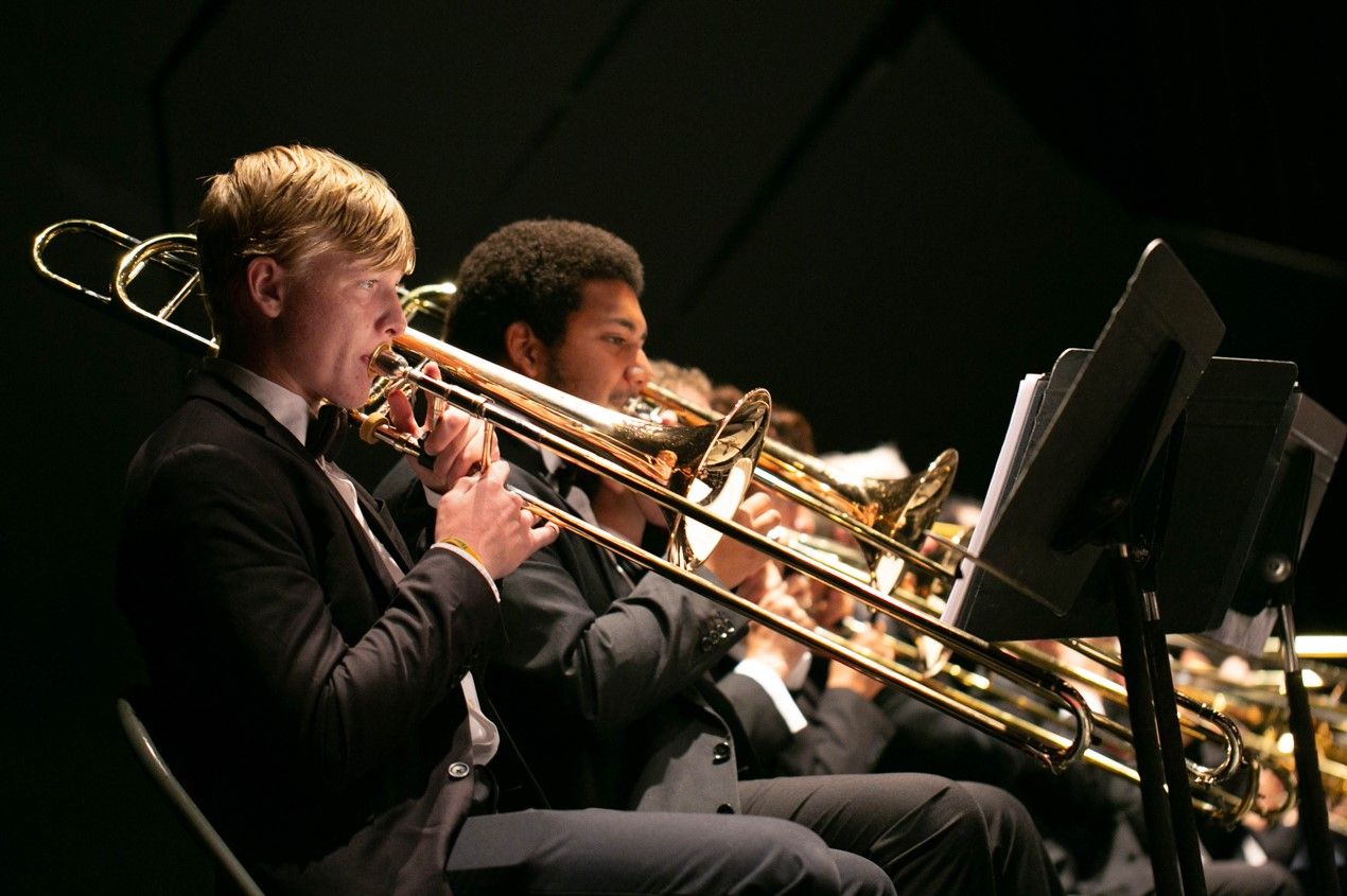 Group of musicians playing trombones
